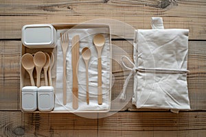 Set of Utensils in Box on Wooden Table