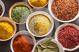 Set of variety aromatic spices and herbs in bowls
