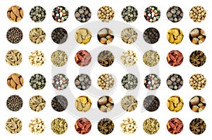 Set of a variety of spices nuts hazelnut almond cashew mix pepper red green white starry anise whole coriander on white background