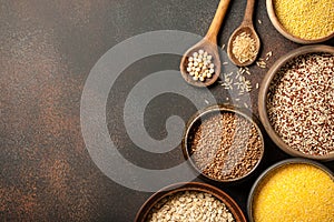Set with various cereal grains on metallic surface