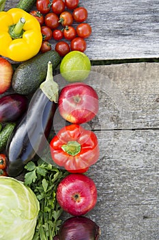 Set of various fruits and vegetables on rustic wooden surface, top view. From above, overhead. Space for text