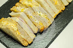 Set of various handmade sandwiches on malted, oatmeal and white bread