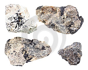 Set of various Ilmenite rocks isolated on white photo