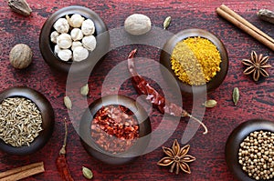 Set of various Indian spices on rusted wooden background