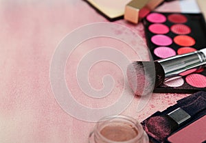 Set of various makeup products in pink tone