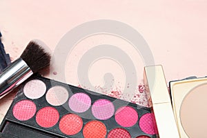 Set of various makeup products in pink tone