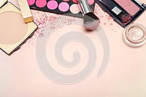 Set of various makeup products in pink tone