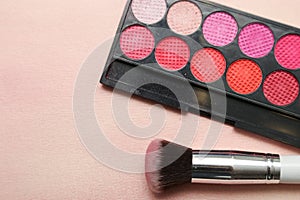 Set of various makeup products in pink tone