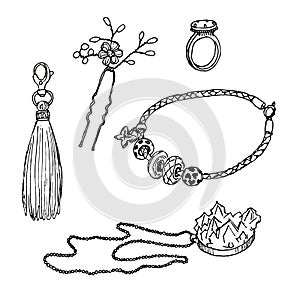 Set of various ornamentations: a ring, a bracelet, a pendant, a hairpin, a keychain with a tassel