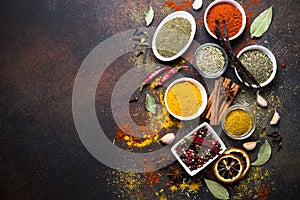 Set of Various spices on dark stone table.