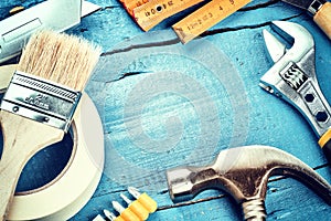 Set of various tools on blue wooden background. Renovation concept