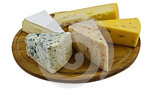 Set of various types of cheese on wooden cutting board isolated on white background