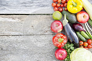 Set of various vegetables and fruits on rustic wooden background