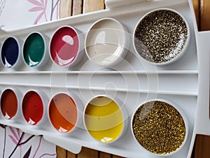 Set of various watercolors in circle containers