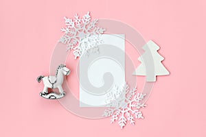 Set of various white Christmas details: gifts and toys on pink background. Top view, flat lay. Free copy space