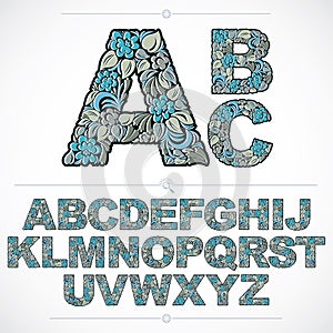 Set of vector ornate capitals, flower-patterned typescript. Blue