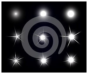 Set of Vector sparkling and glowing light effect stars