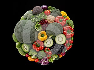 A set of vegetables on a black background. The concept of healthy eating or vegetarianism. Close up