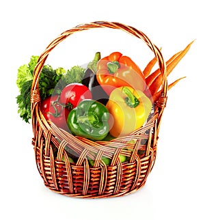 A set of vegetables in wricker basket isolated