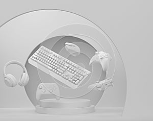 Set of video game joystick, keyboard and headphones on monochrome podium