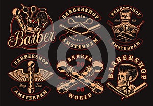 Set of vintage barbershop emblems on a dark background