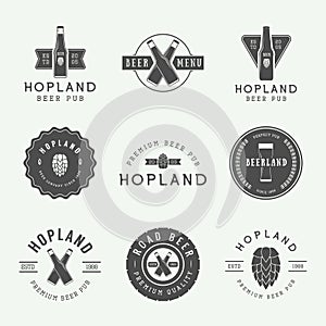 Set of vintage beer and pub logos, labels and emblems with bottles, hops, and wheat