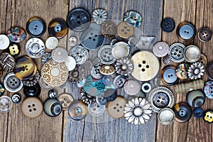 Set of vintage buttons on aged table. close up