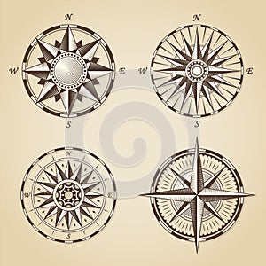 Set of vintage old antique nautical compass roses. Vector signs