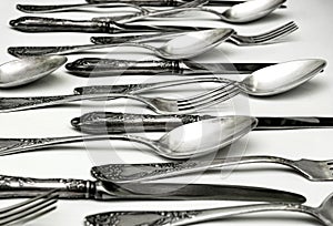 Set of vintage silver spoons and forks isolated on white background