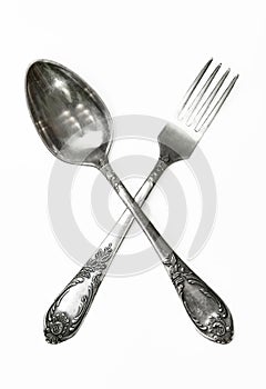 Set of vintage silver spoons and forks isolated on white background