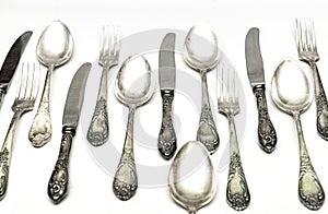 Set of vintage silver spoons and forks isolated on white background