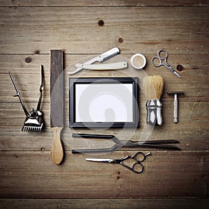 Set of vintage tools of barber shop with empty picture frame