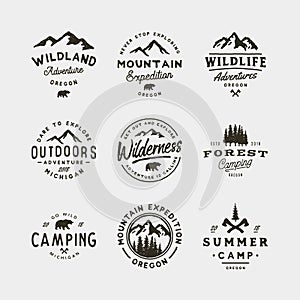 Set of vintage wilderness logos. hand drawn retro styled outdoor adventure emblems. vector illustration photo