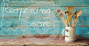 Set of vintage wooden spoons in a beer mug. Restaurant announcing reopening after the corona lockdown. Gastronomy business