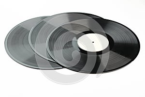 Set of vinyl records over white background.