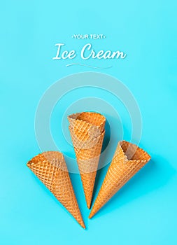 A set of waffle cones for ice cream on a blue background.