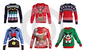 Set of warm Christmas sweaters on background