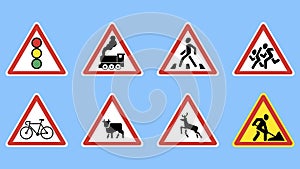 Set of Warning road signs on a blue background.