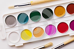 Set of watercolor paints and brushes for painting