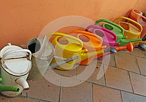 Watering cans of many colors photo
