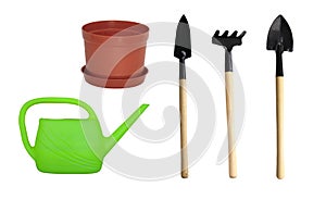 Set of watering little green can, brown pot for flowers and mini gardening tools on white isolated background