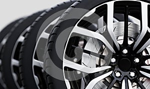 Set of wheels with modern alu rims close-up on white