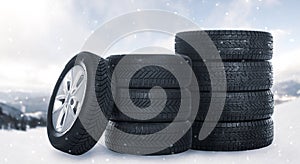 Set of wheels with winter tires outdoors on snow
