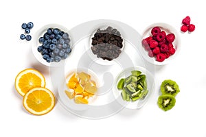 Set of white bowls full of dried and fresh fruit arranged as five Olympic rings