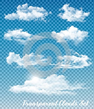 Set of white clouds on a transparent sky background.