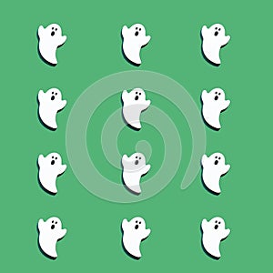 Set of white ghosts isolated on green color background. Halloween ornament is colorful Tones