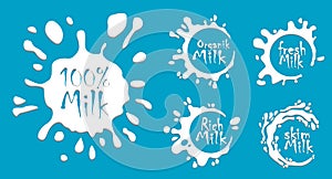 set white milk splash and blot isolated on blue background. milk yogurt or cream logo. milk labels set.