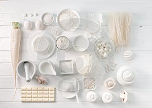 Set of white objects on white table, topview