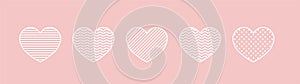 Set of white outline heart cliparts with various textures isolated on pink background