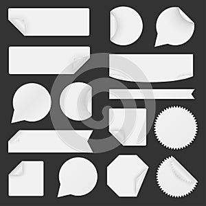 Set of white paper stickers on black background